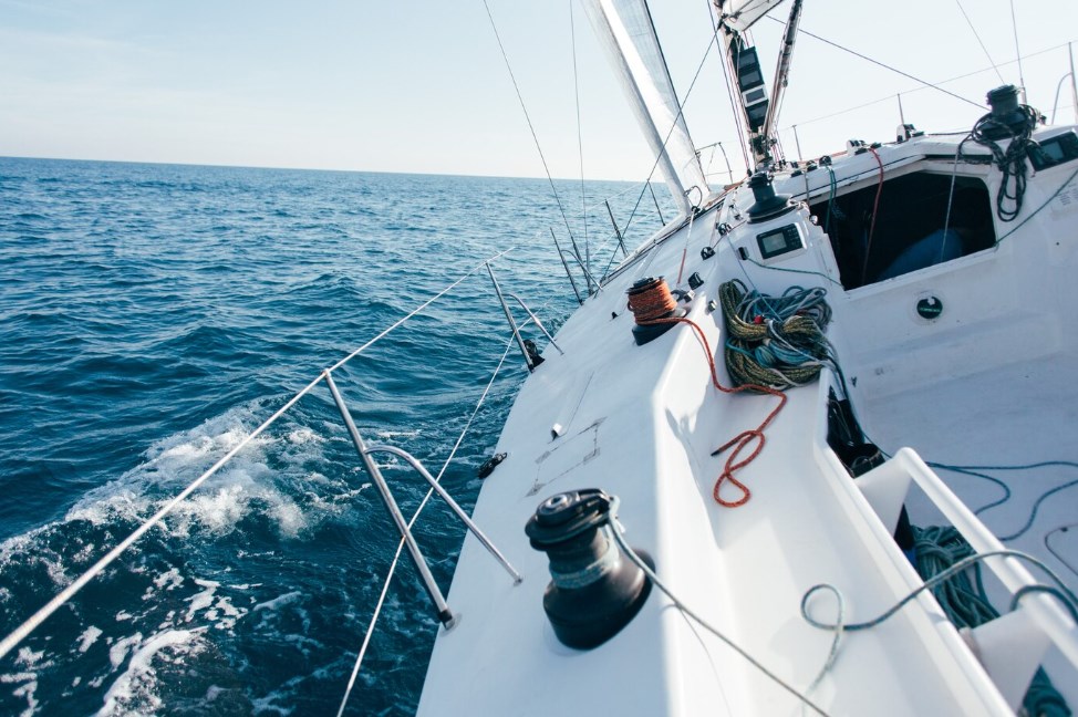 a professional sailboat moving fast through the waves