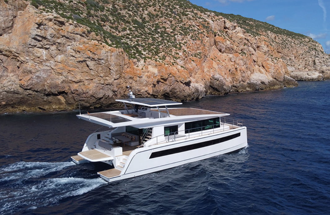 electric yacht sails on the sea near the shore