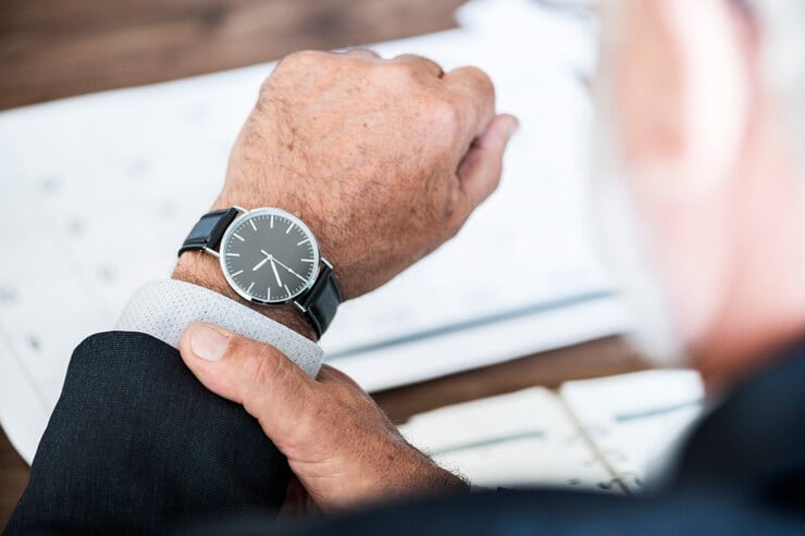 Man Checking Time on Handwatch